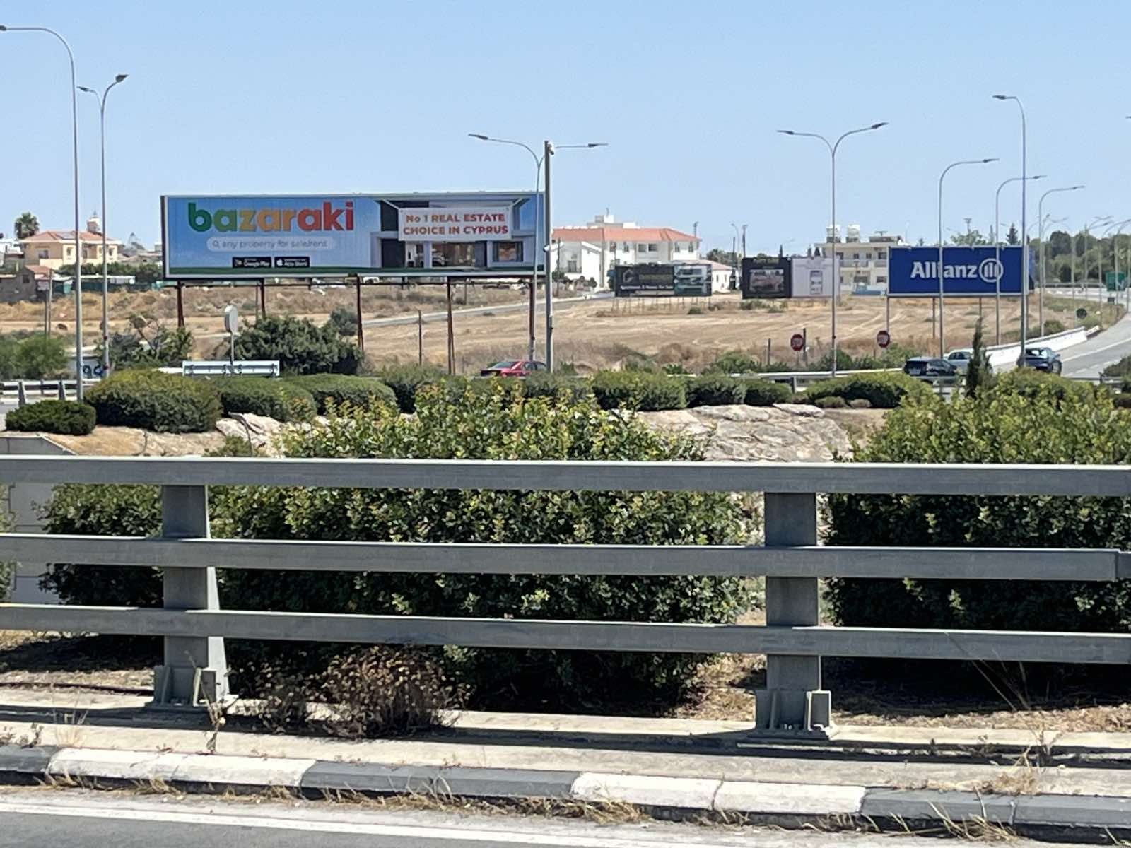 Super Tri-Vision board beside a highway junction